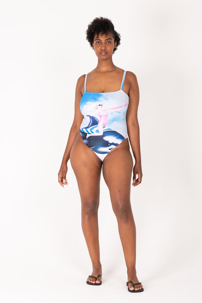 Woman wearing a swimsuit with a colorful design on a white background