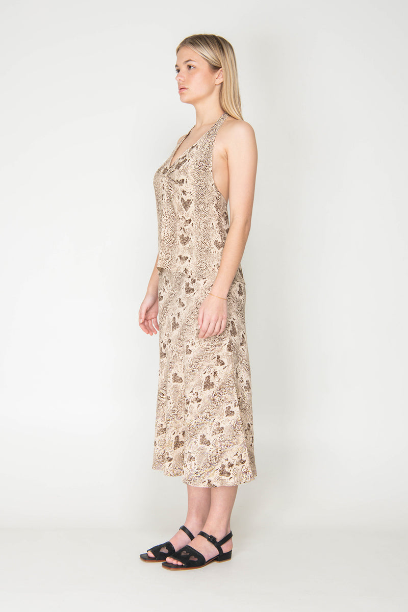 Woman wearing a floral dress against a white background