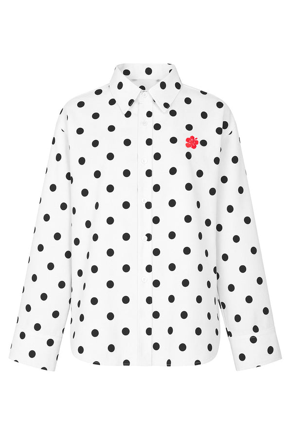 White dress shirt with black polka dots and a red flower on a white background