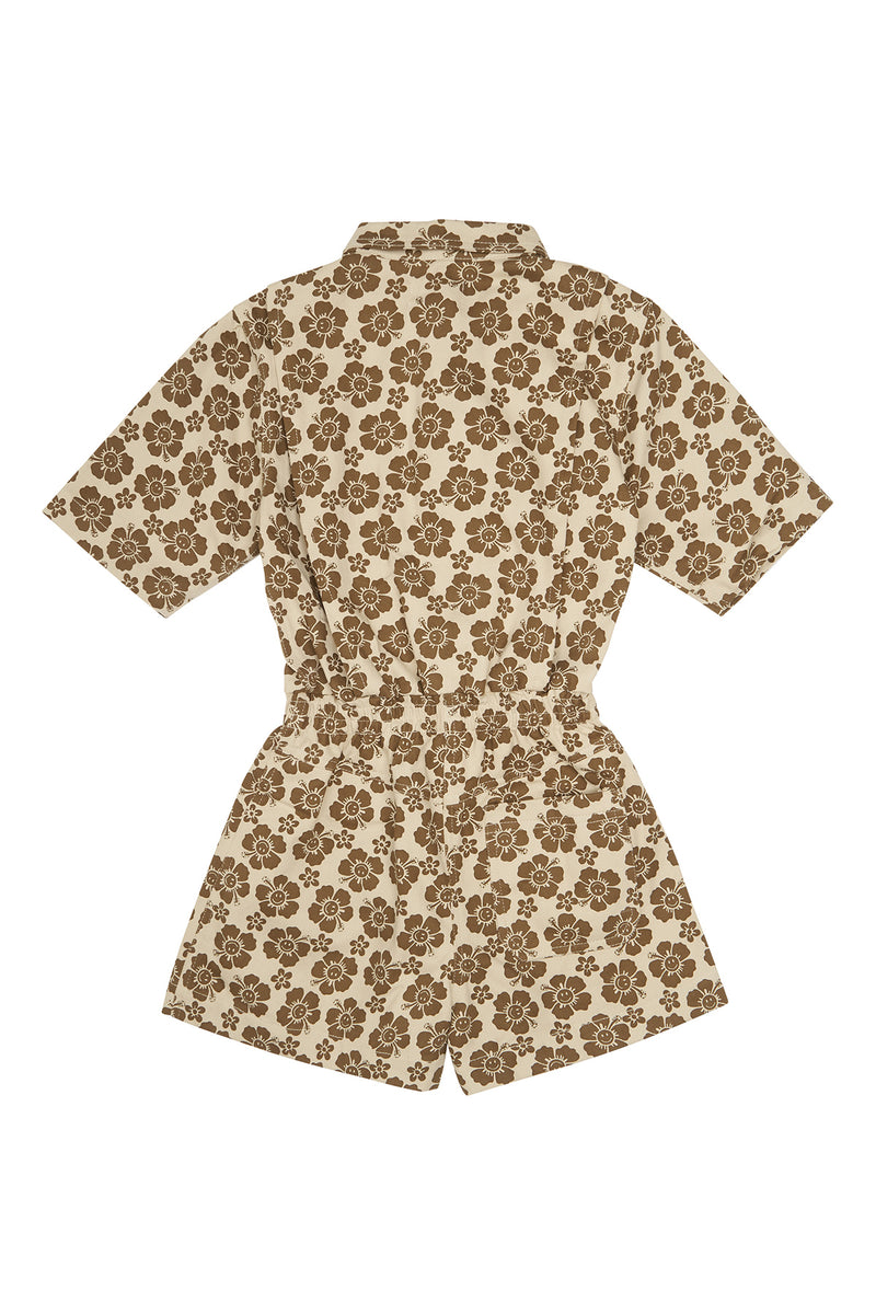 Floral patterned romper on a white background