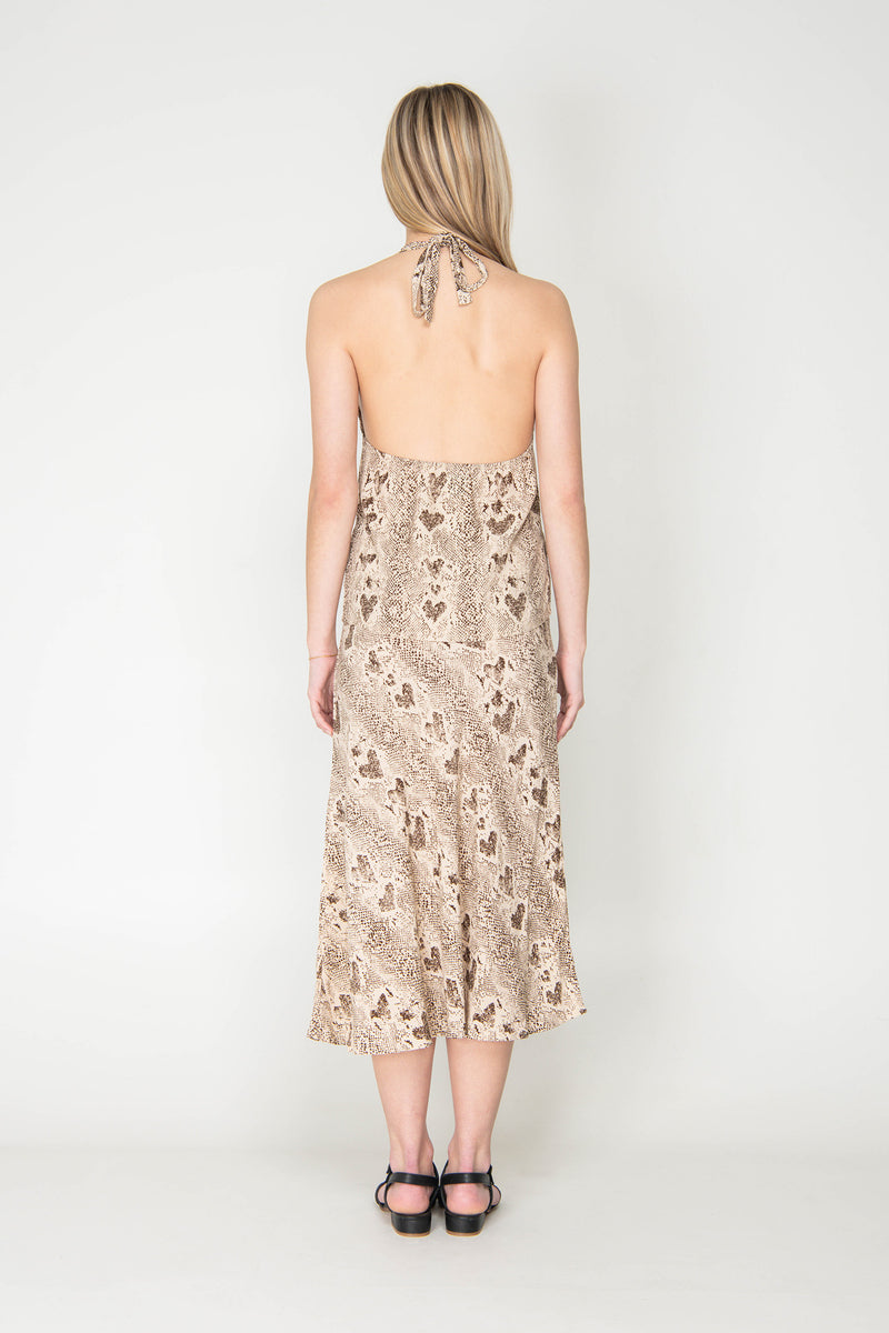 Woman wearing a floral dress with a white background