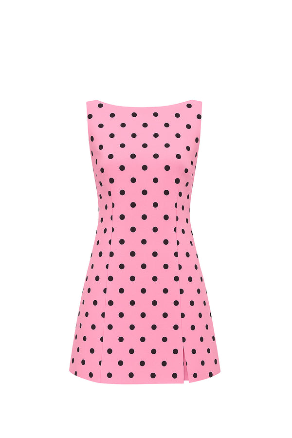 Pink dress with black polka dots on a white background