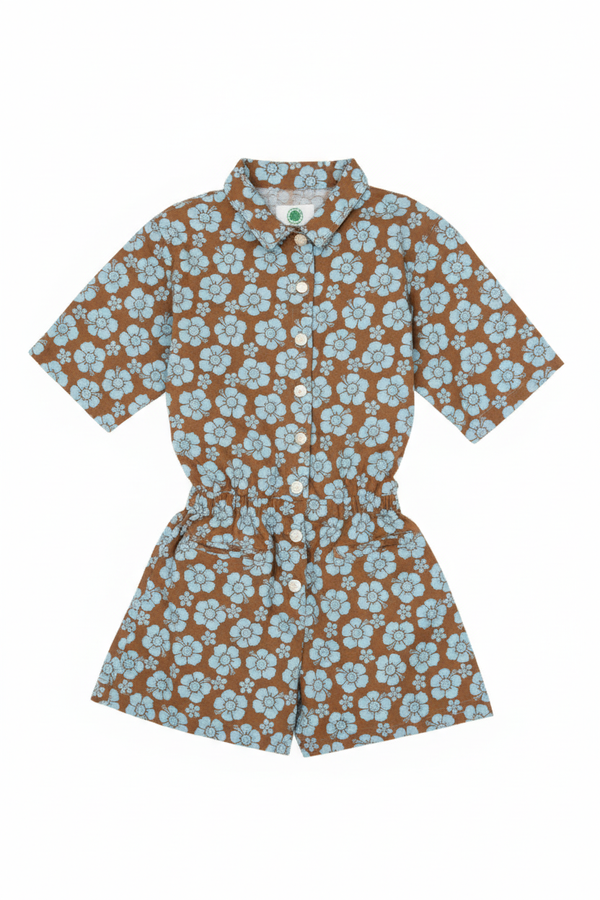 Floral patterned romper on a white background