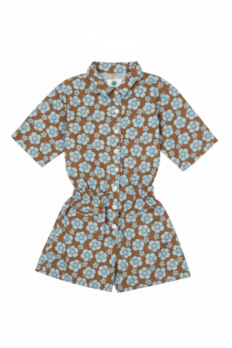 Floral patterned romper on a white background