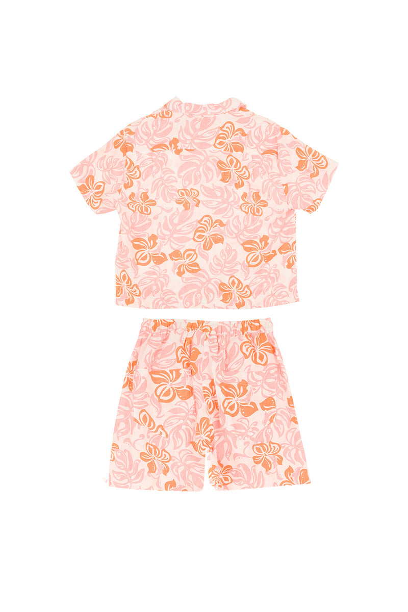 Pink pajama set with orange floral pattern on a white background