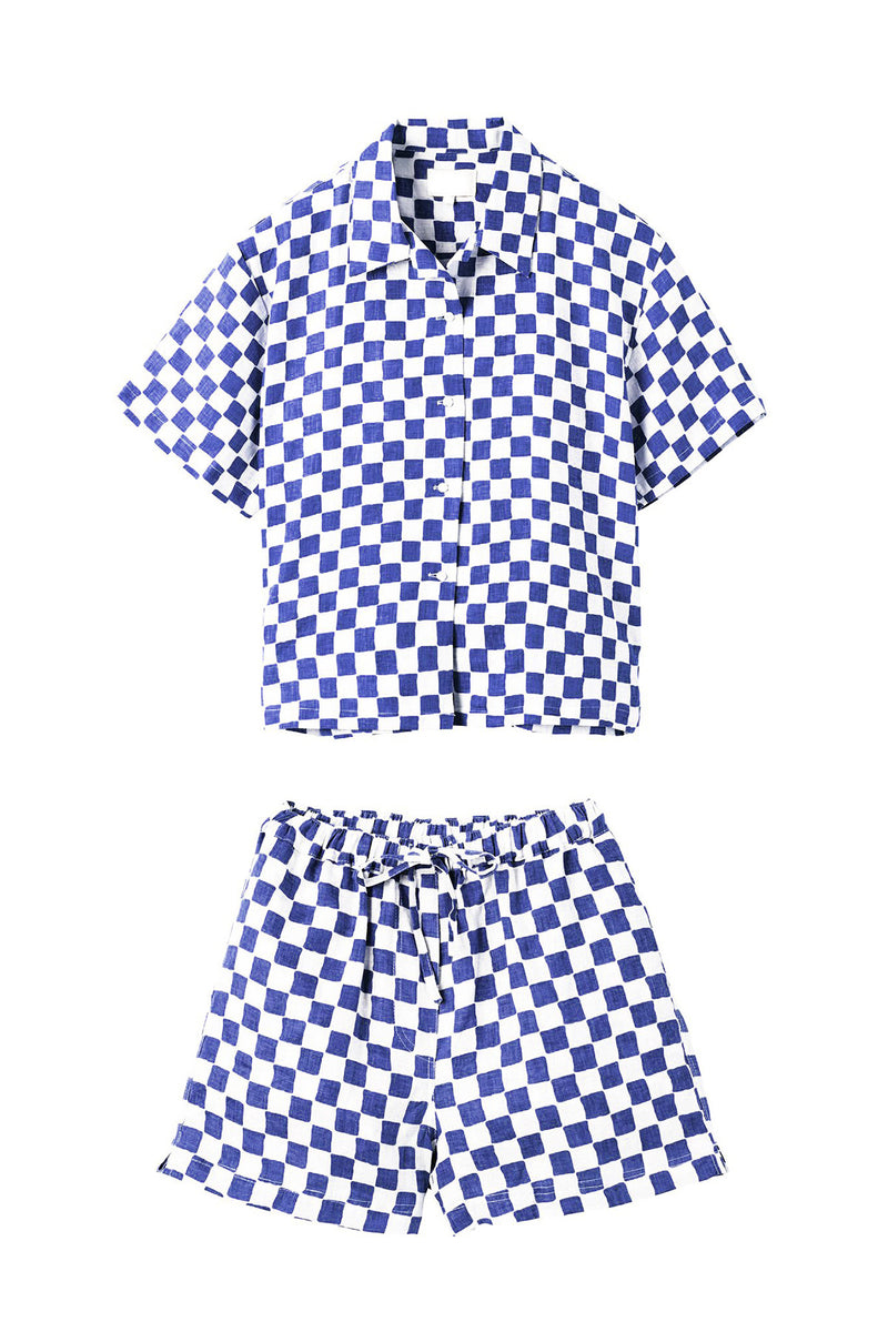 Blue and white checkered shirt and shorts set on a white background