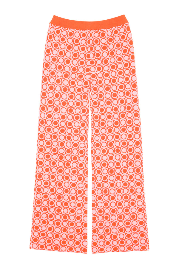 Orange pants with a circular pattern on a white background