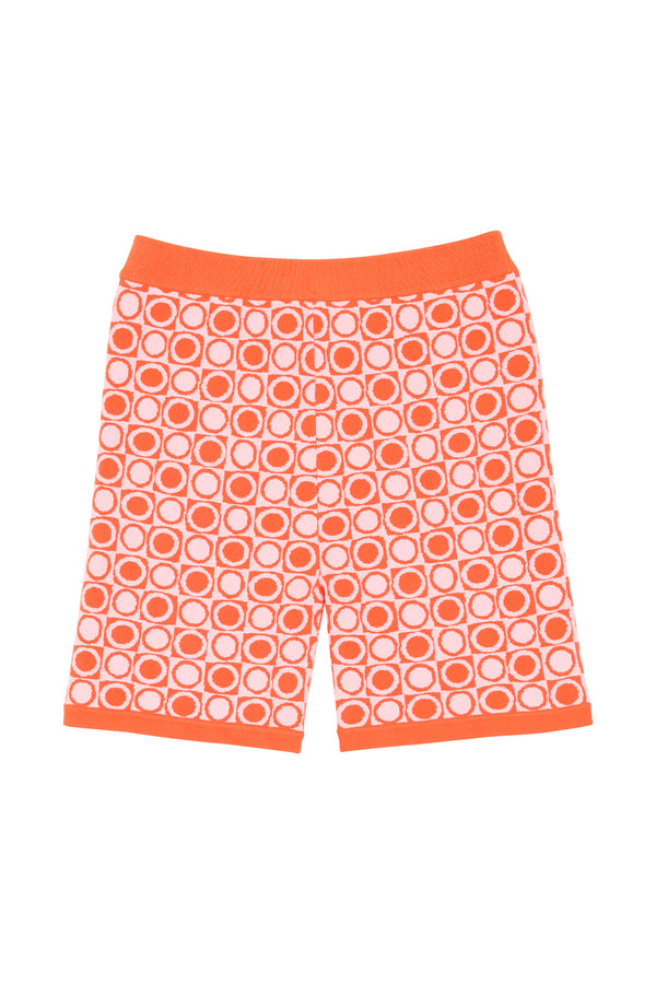Orange shorts with a geometric pattern on a white background