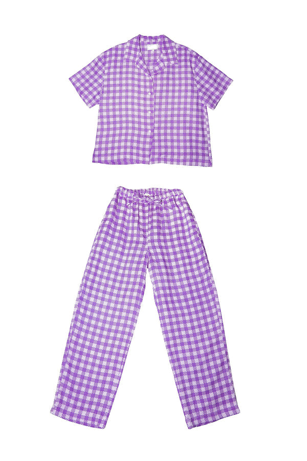Purple gingham shirt and pants set on a white background