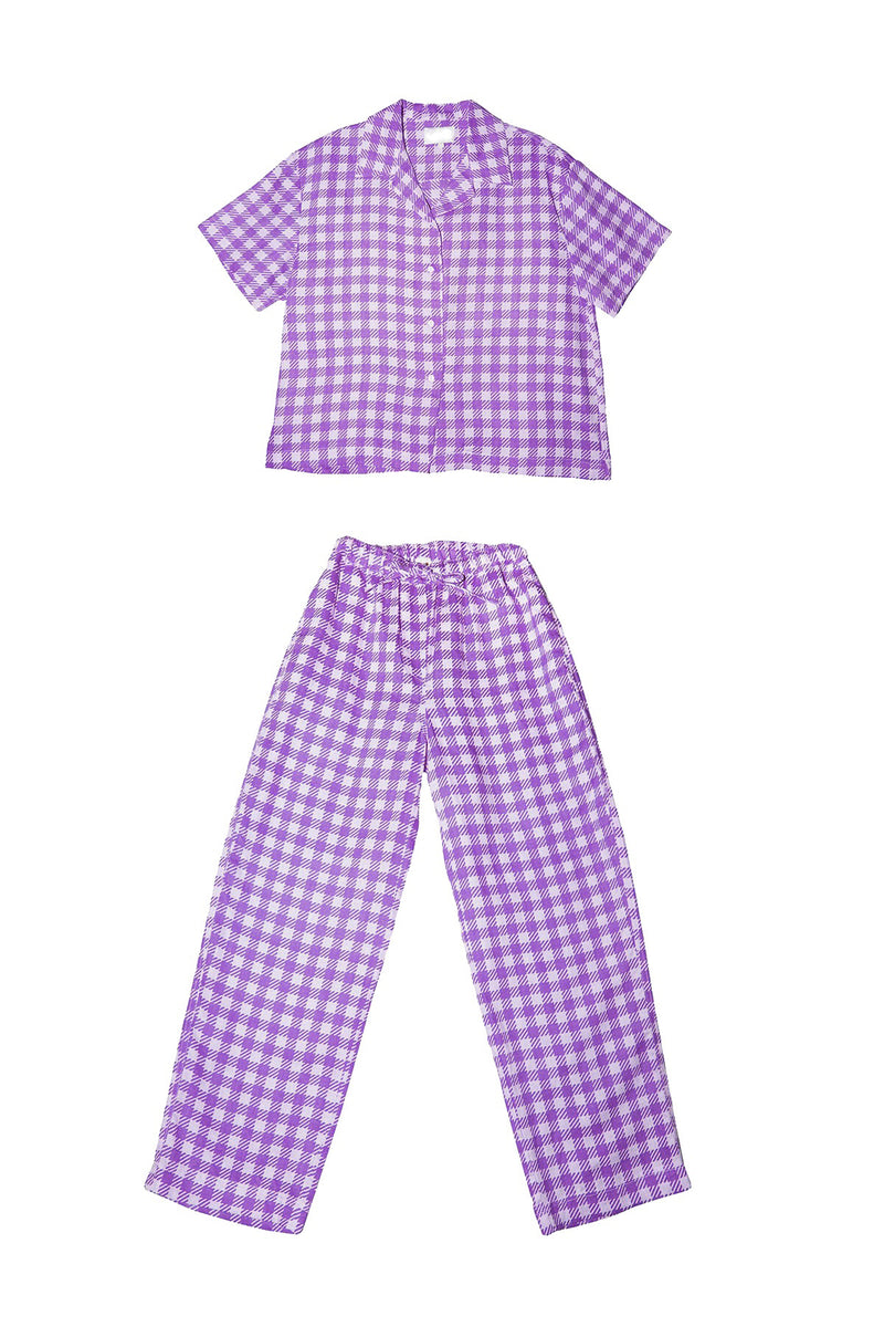 Purple gingham shirt and pants set on a white background
