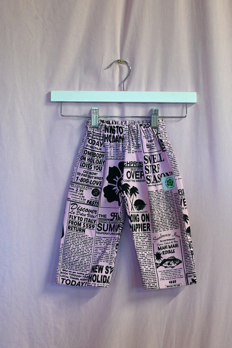 Good News Kids Pants on a pink background