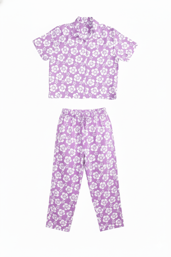 Purple floral pajama set on a white background