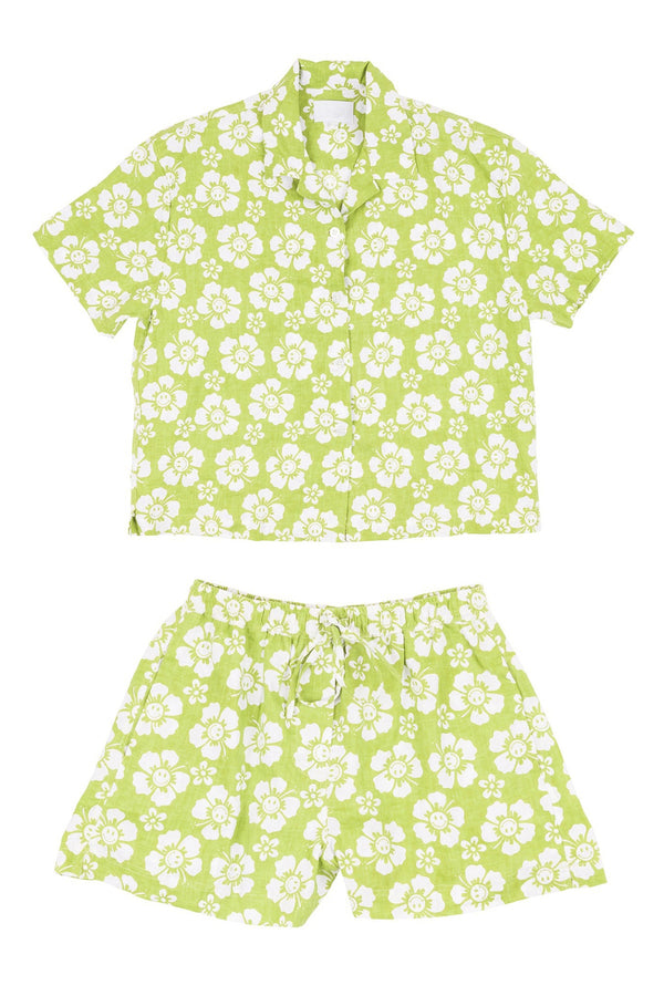 Green and white floral shirt and shorts set on a white background