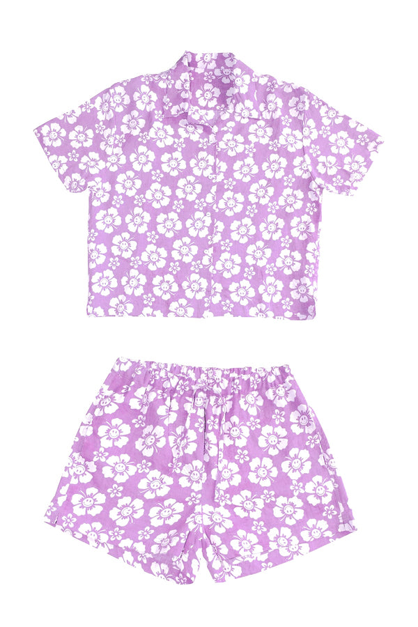 Purple floral shirt and shorts set on a white background