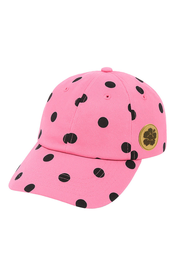 Pink cap with black polka dots and a gold logo on a white background