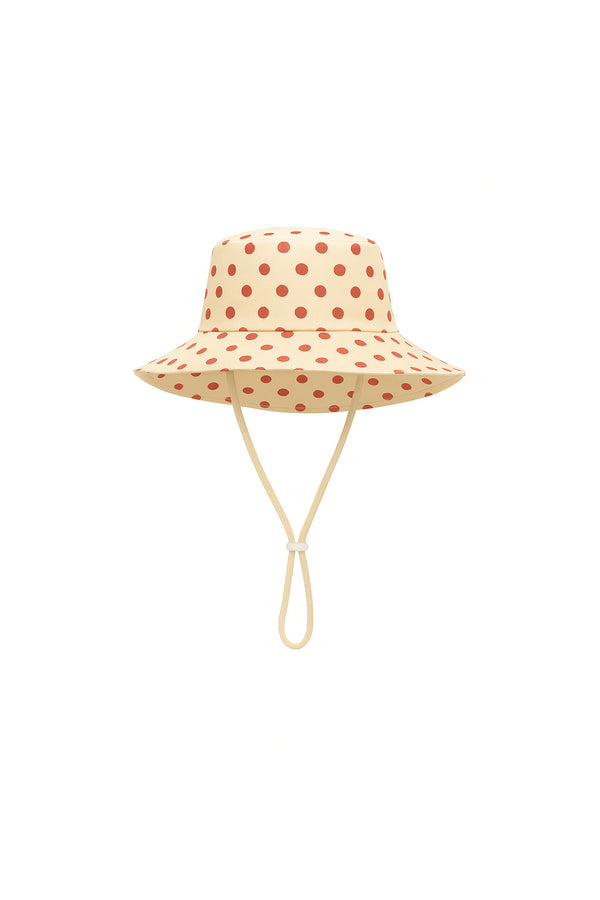 Polka dot bucket hat with a strap on a white background for kids 