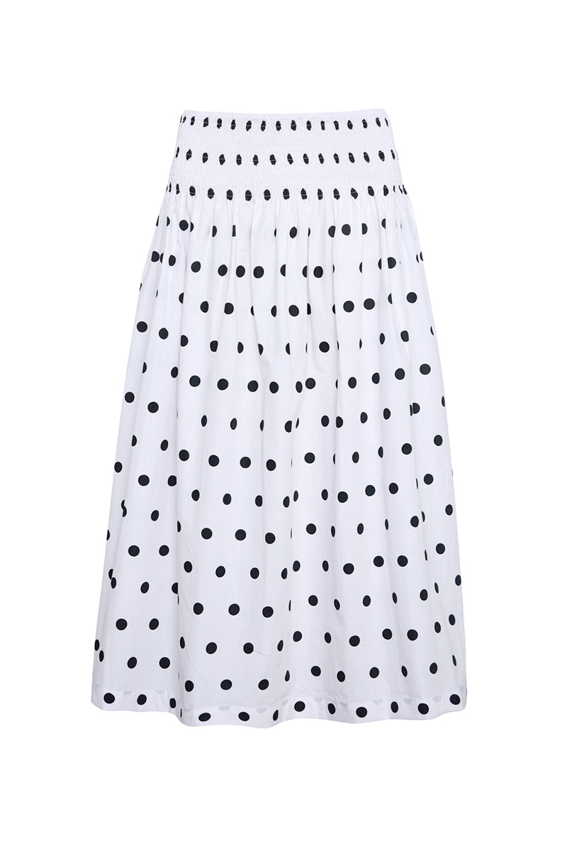 White skirt with black polka dot pattern on a white background