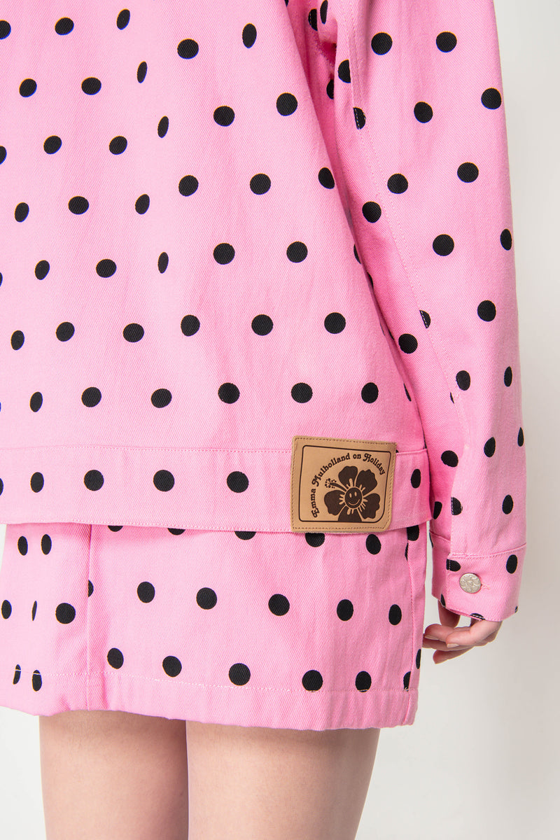 Pink polka dot jacket with a brand logo on a white background
