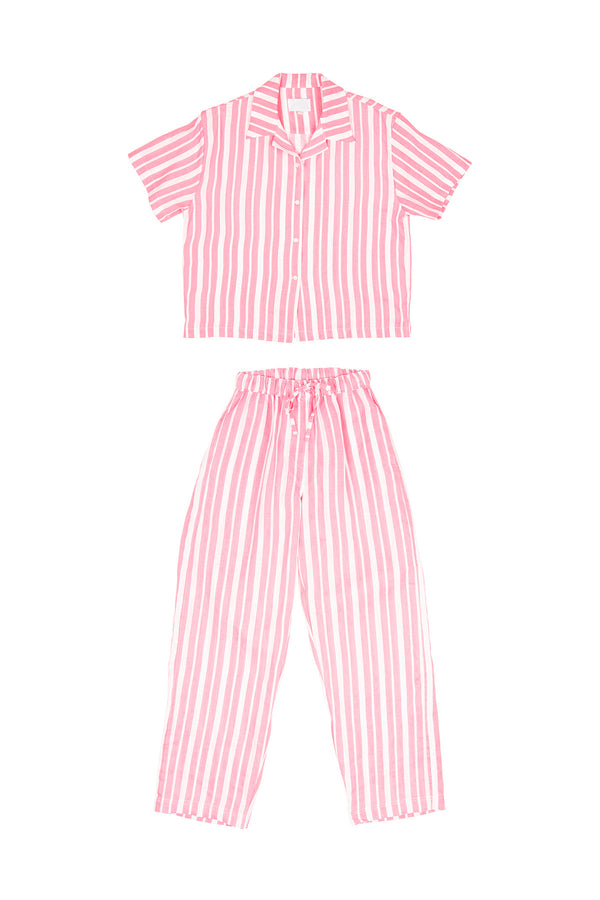 Pink and white striped pajama set on a white background