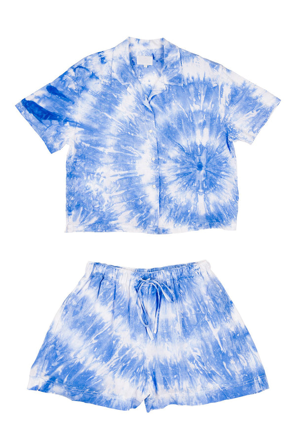 Blue and white tie-dye shirt and shorts set on a white background